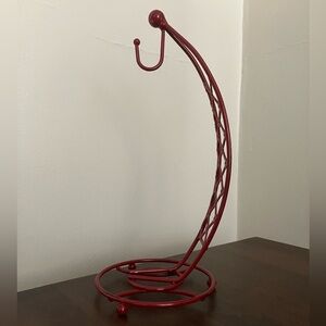 red metal banana stand